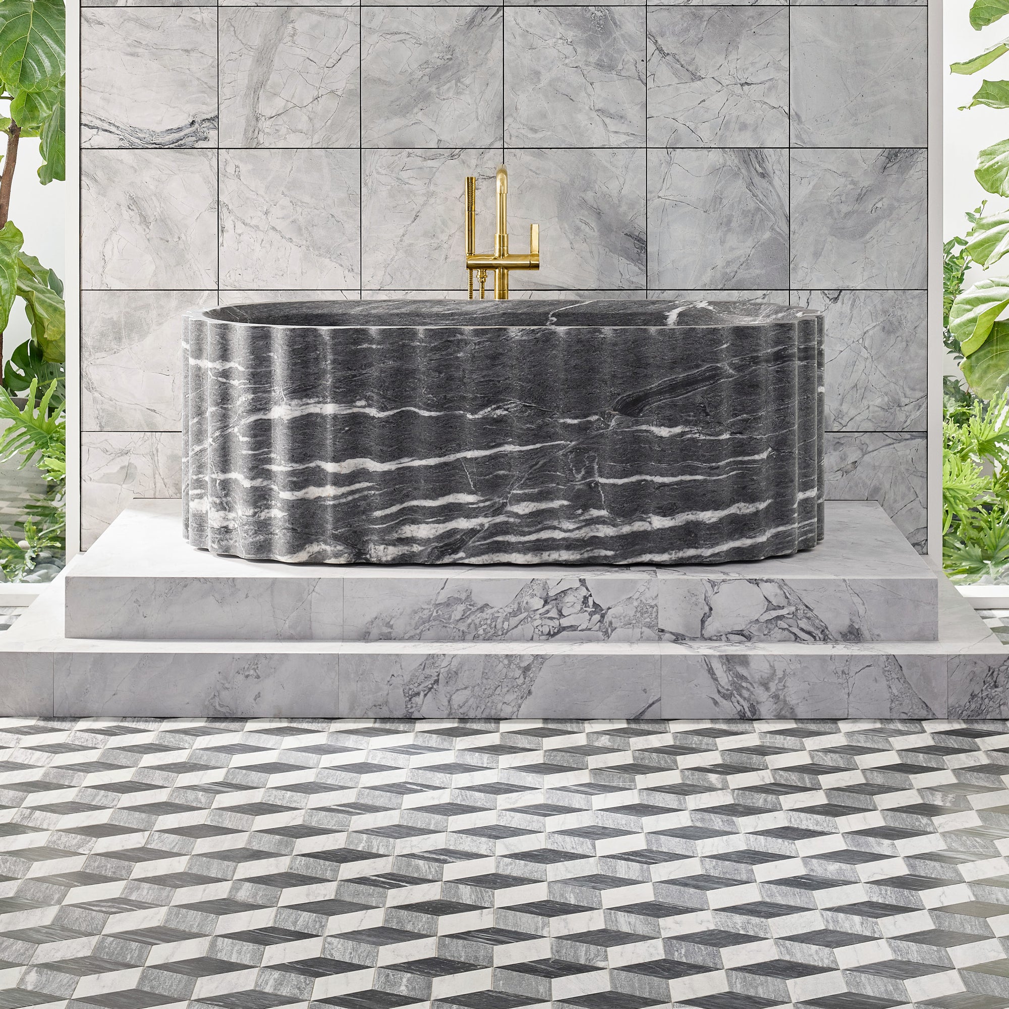 Fluted Bath in Catia Black. Shown with Kallista One Freestanding Bath Faucet in Unlacquered Brass, Contemporary Wand Dual-Function Handshower in Unlacquered Brass